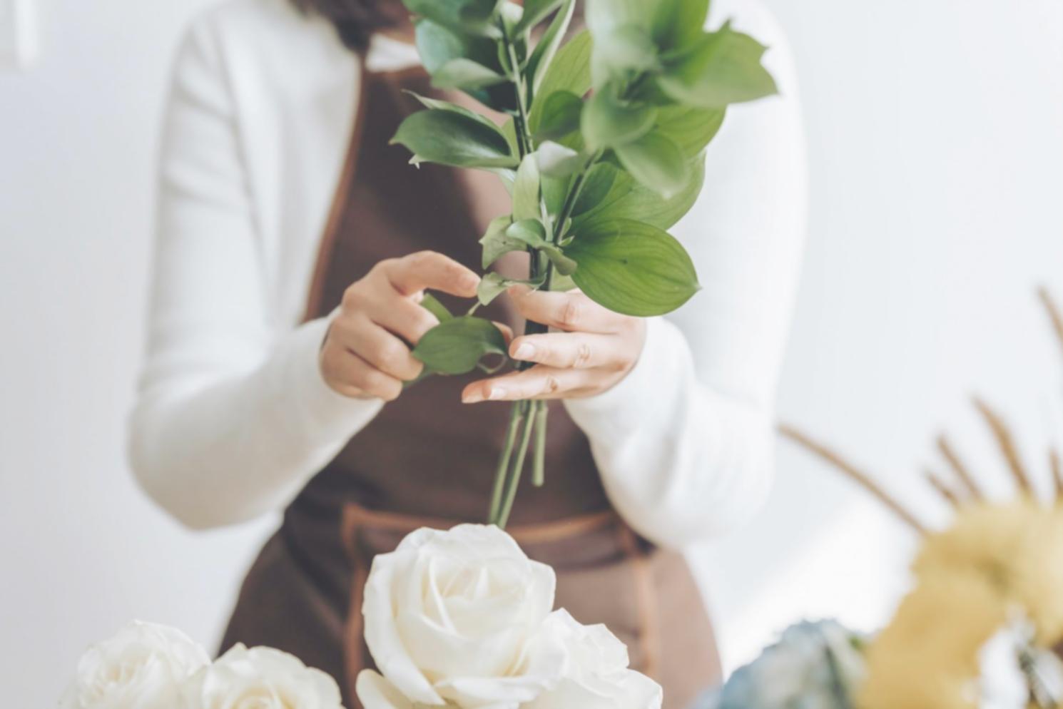 Professional flower arrangement and care techniques demonstration